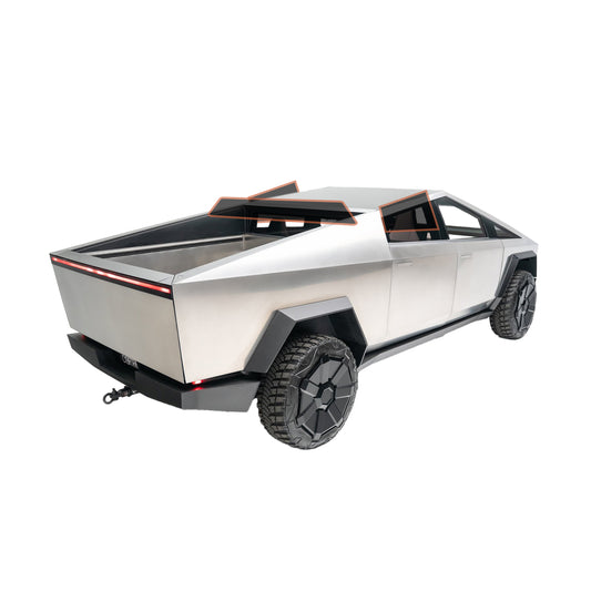 A silver aluminum truck with a spacious bed, showcasing its sturdy design and functionality.

